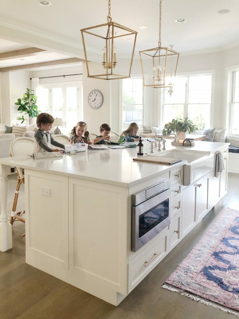 all white kitchen with kids