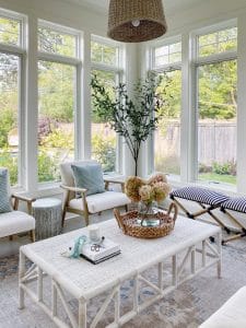Pottery Barn Finn rug featured in my sunroom with an outdoor coffee table