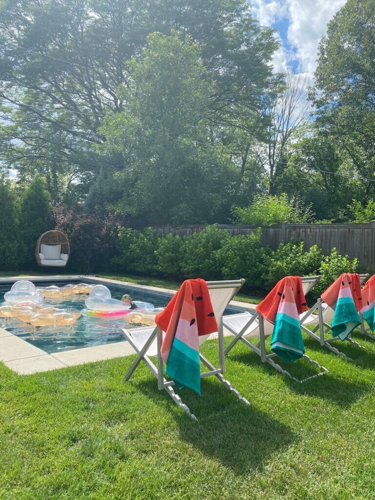 Backyard pool with concrete surround and sling chairs | Making the Most of Summer with Walmart+