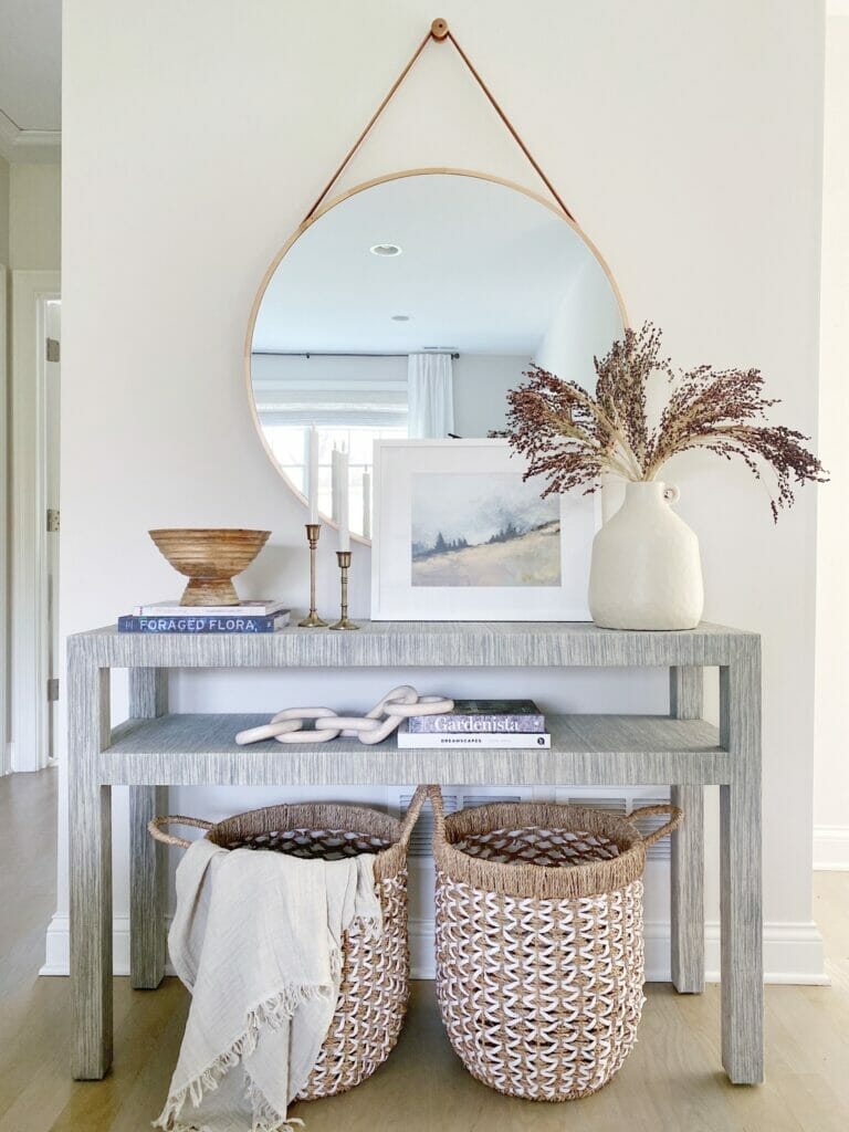 Serena and Lily blake console table, paired with a hanging round mirror, and fall decor styling 