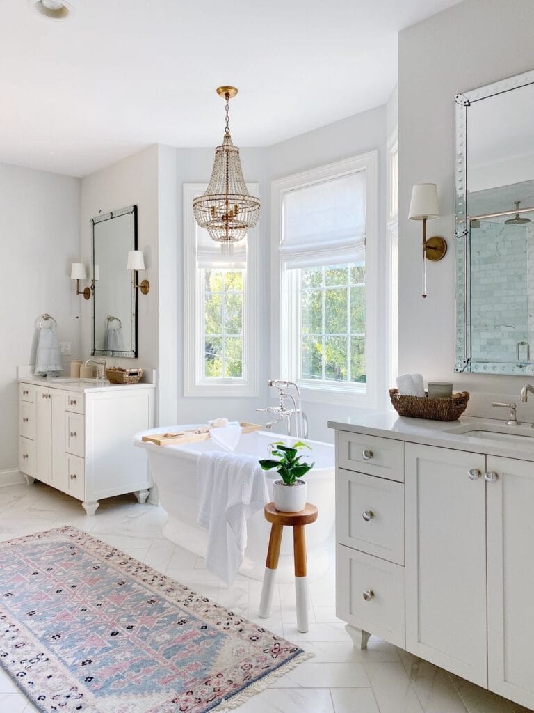 bathroom with two white vanities with mirrors
