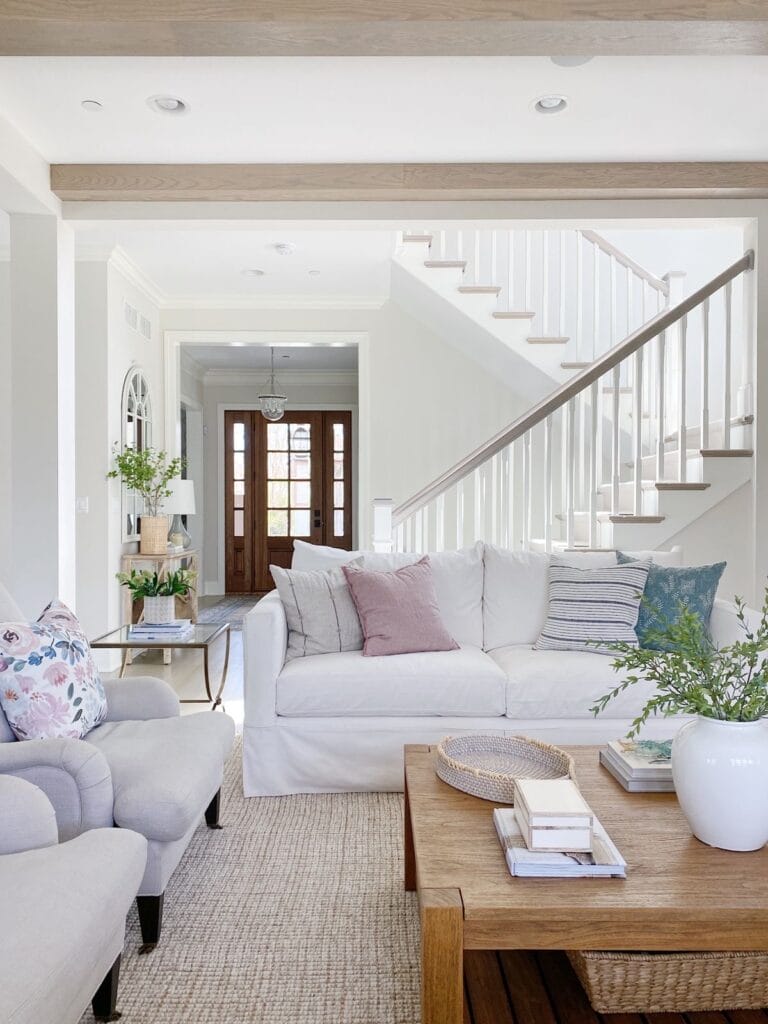 living room with white couch and chairs | How to Mix and Match Throw Pillows
